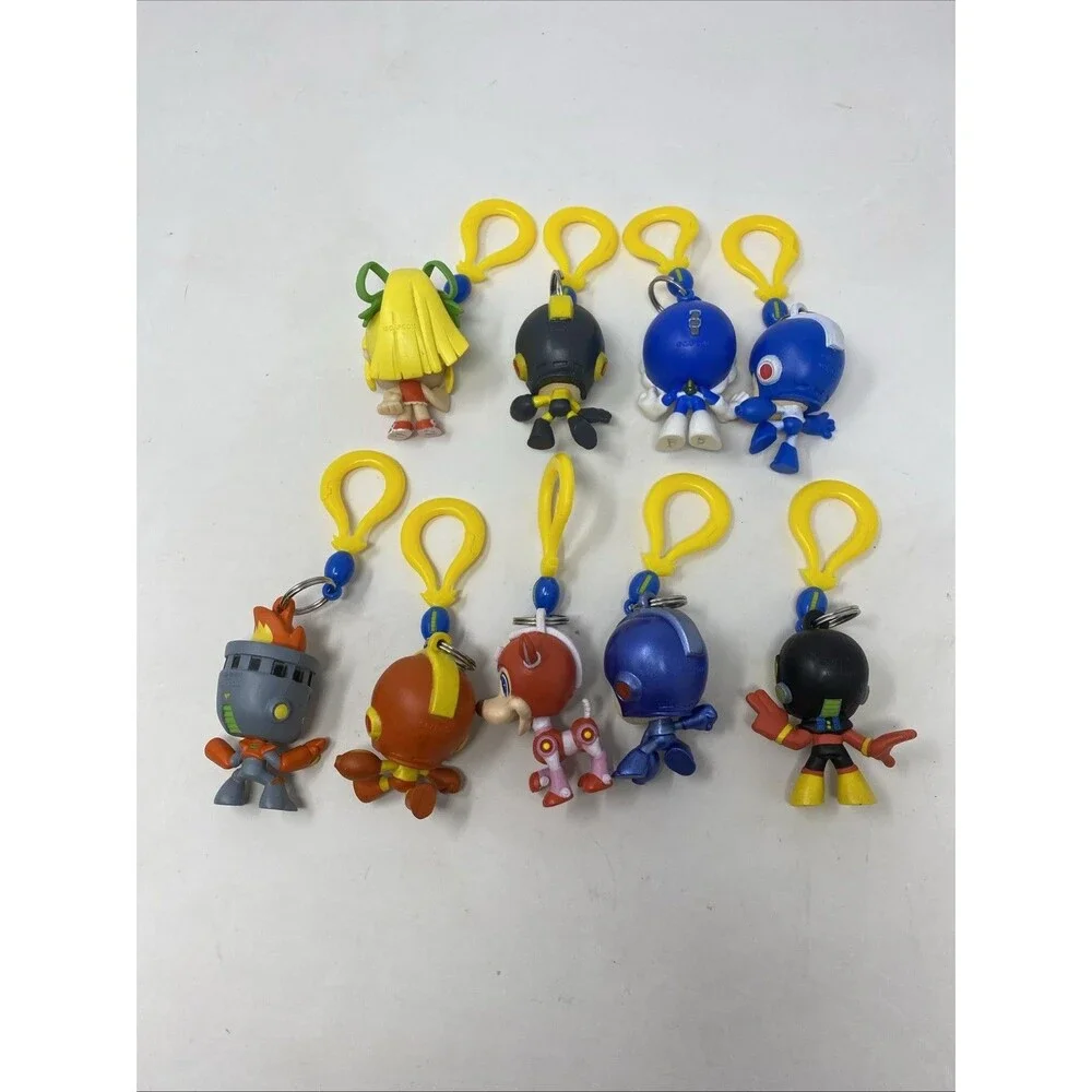 lot of 9 CAPCOM MEGA MAN BACKPACK HANGERS METALLIC FIRE MAN JUST TOYS INTL.